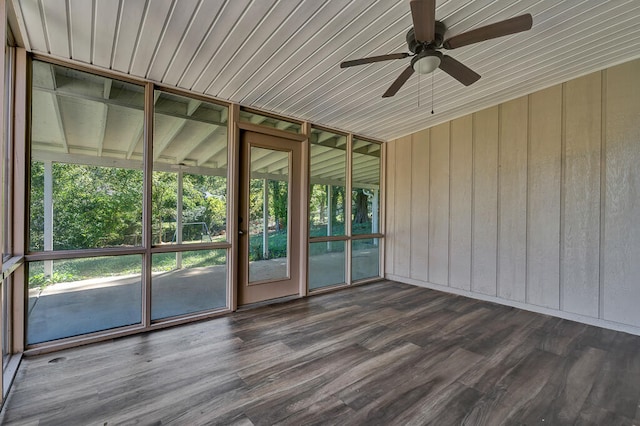 unfurnished sunroom featuring ceiling fan and a healthy amount of sunlight