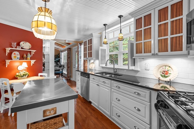 260 Sequoia Rd NW, Cleveland, TN 37312 - kitchen featuring stainless steel counters, stainless steel appliances, crown molding, decorative columns, and dark wood-type flooring