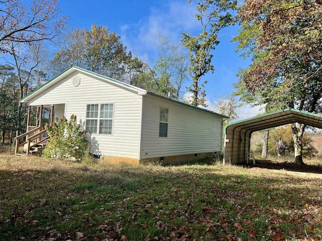 view of home's exterior with a carport