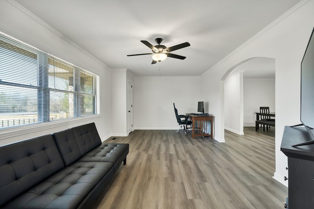 living room with ceiling fan, ornamental molding, and hardwood / wood-style floors