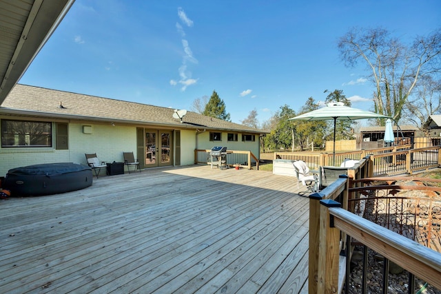 wooden terrace with french doors and grilling area