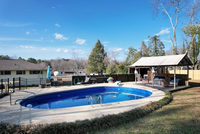 view of swimming pool featuring a gazebo