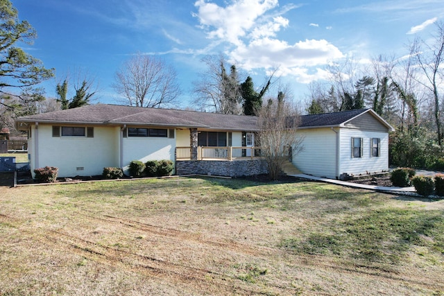 ranch-style home with a front lawn