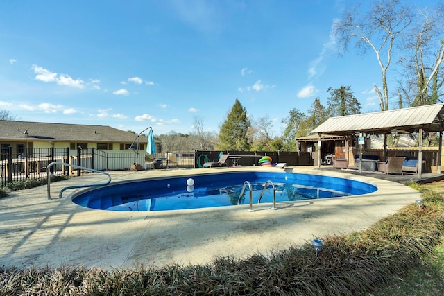 view of swimming pool featuring a gazebo