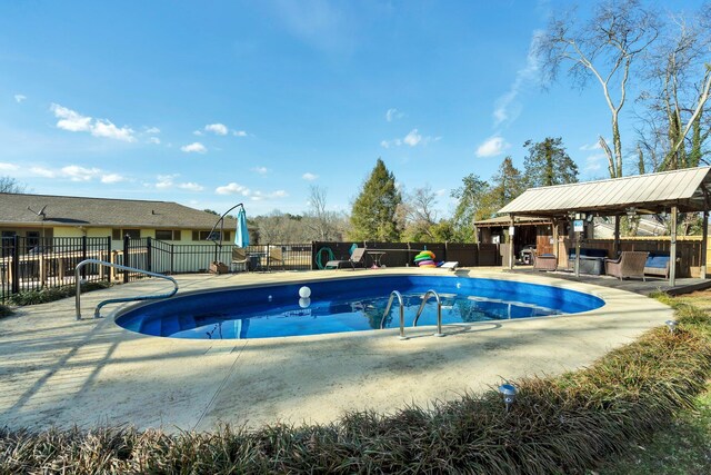 view of swimming pool featuring a gazebo