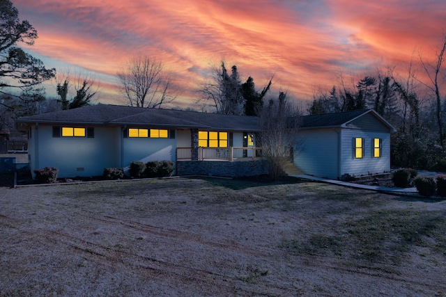 ranch-style house with a yard