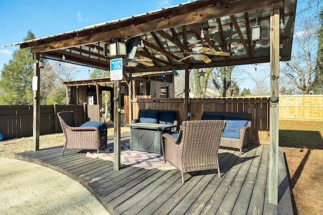 wooden terrace featuring ceiling fan