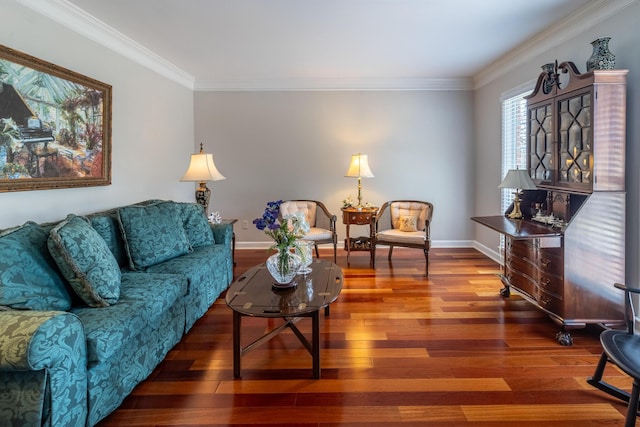 living area with baseboards, wood finished floors, and crown molding