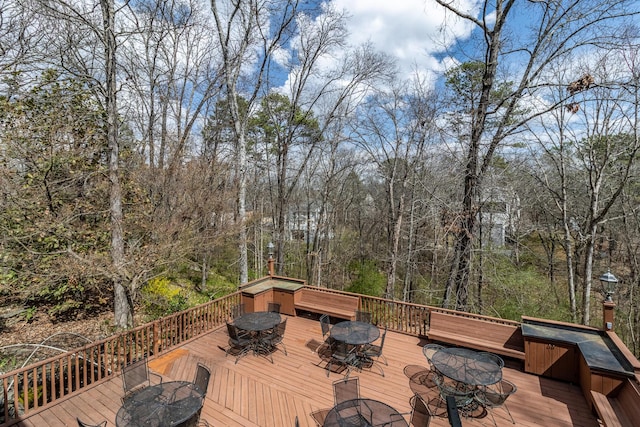 deck with outdoor dining area