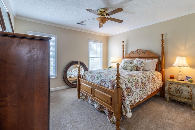 carpeted bedroom featuring a ceiling fan, baseboards, visible vents, a textured ceiling, and crown molding