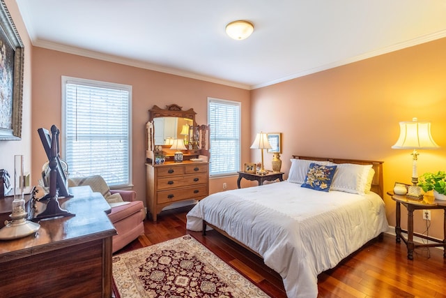bedroom with baseboards, crown molding, and hardwood / wood-style flooring
