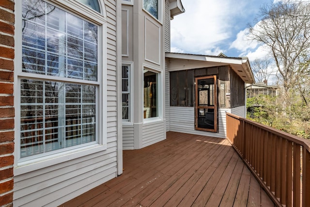 wooden terrace featuring a sunroom