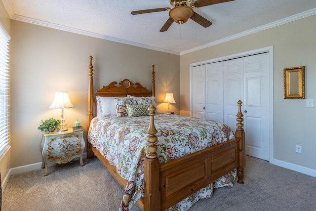 bedroom with crown molding, carpet, a closet, and baseboards