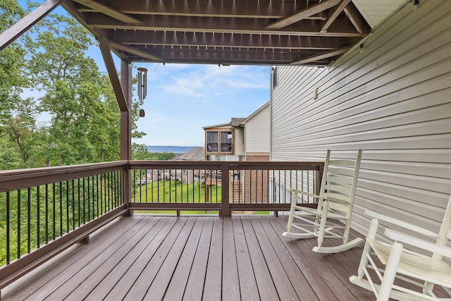 wooden terrace with a yard