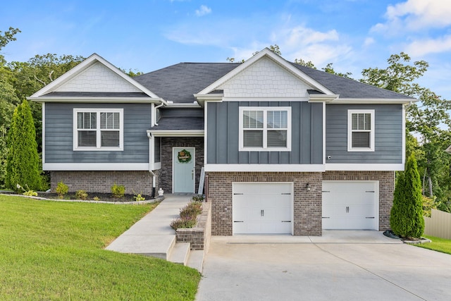 view of front of home with a garage and a front lawn