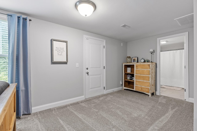 unfurnished bedroom with light carpet