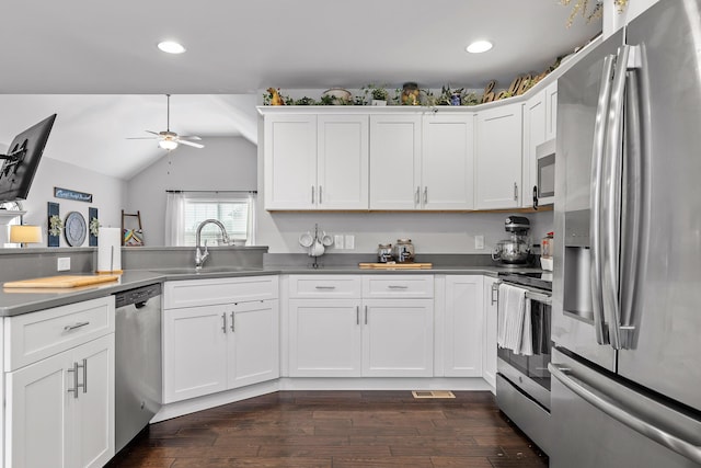 kitchen with white cabinets, appliances with stainless steel finishes, and sink