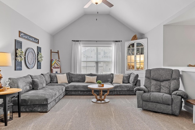 living room featuring carpet floors, vaulted ceiling, and ceiling fan