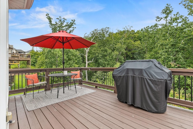 wooden deck with grilling area