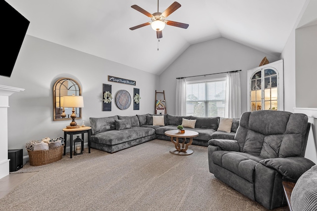 living room with ceiling fan, carpet floors, and lofted ceiling