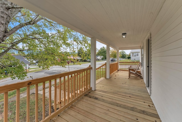 wooden terrace featuring a porch