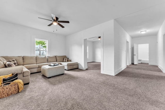 living room featuring ceiling fan and carpet floors