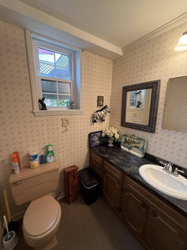 2510 Burning Tree Dr NW, Cleveland, TN 37312 - half bathroom featuring vanity, toilet, ornamental molding, a textured ceiling, and wallpapered walls