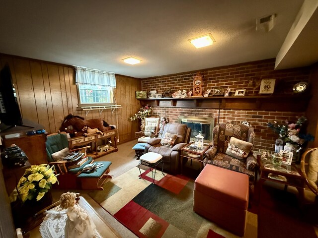 2510 Burning Tree Dr NW, Cleveland, TN 37312 - sitting room with wooden walls, a fireplace, and brick wall