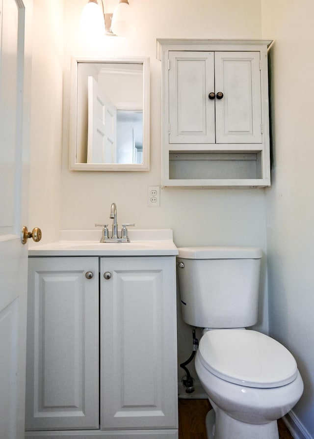 bathroom with toilet and vanity