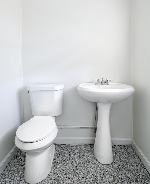 bathroom featuring toilet