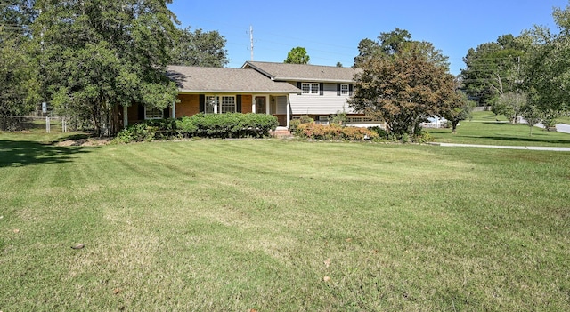 tri-level home featuring a front lawn