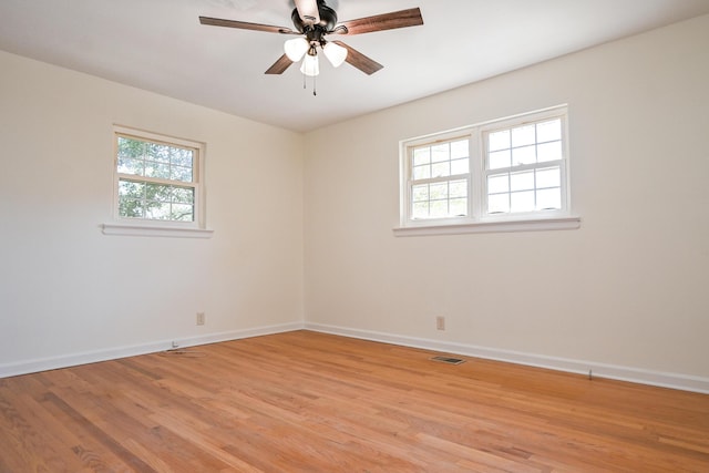 spare room featuring ceiling fan and light hardwood / wood-style flooring