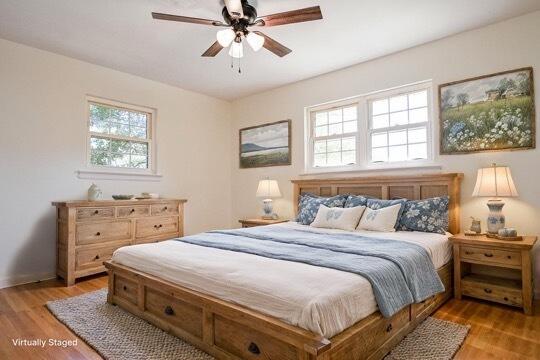 bedroom featuring ceiling fan and light hardwood / wood-style flooring