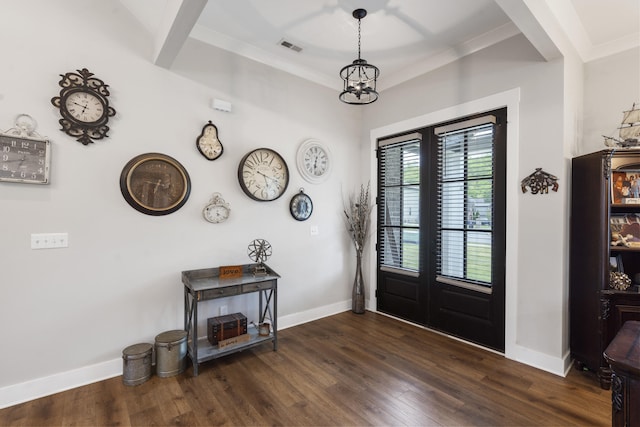 entrance foyer featuring visible vents, baseboards, dark wood-style flooring, and french doors