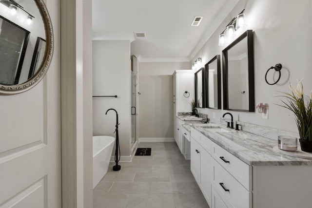 full bathroom featuring a soaking tub, a stall shower, ornamental molding, and a sink