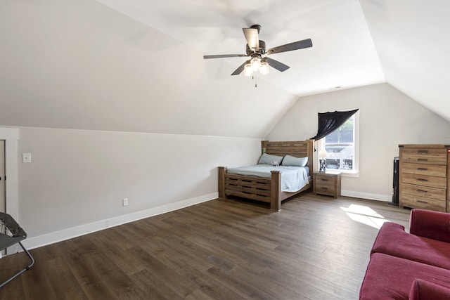 bedroom with lofted ceiling, a ceiling fan, wood finished floors, and baseboards