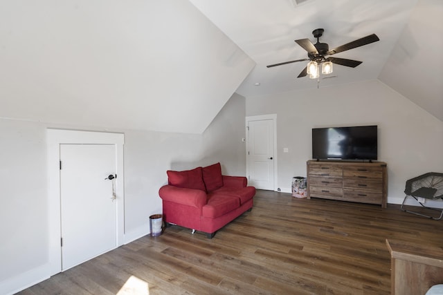 interior space featuring lofted ceiling, a ceiling fan, baseboards, and wood finished floors