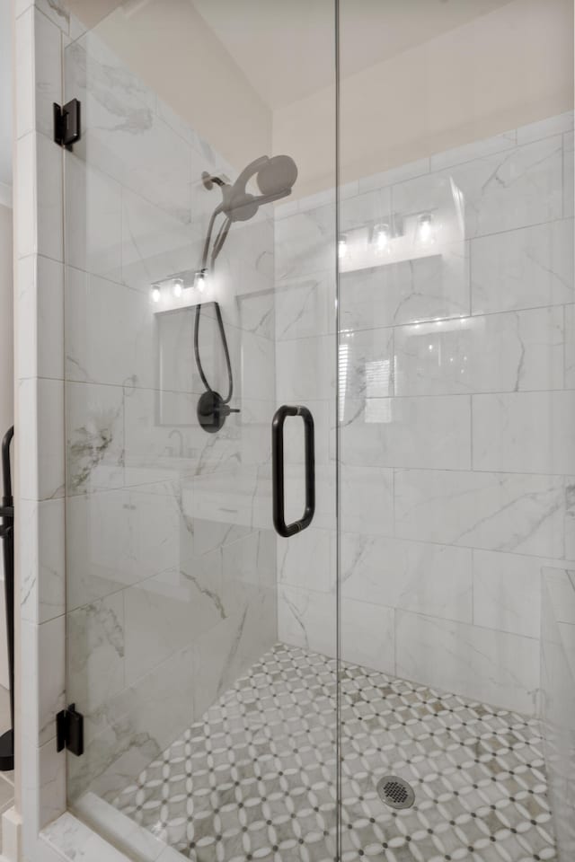 bathroom with a shower stall