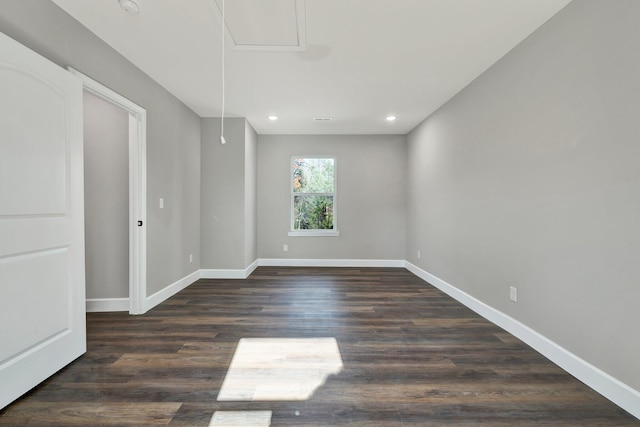 spare room with dark hardwood / wood-style flooring