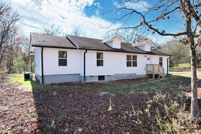 view of side of property featuring central air condition unit