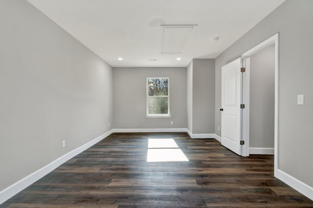 unfurnished room featuring dark wood-type flooring