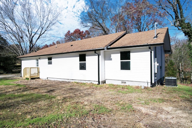 rear view of house with central air condition unit