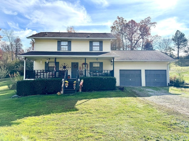 view of front property with a garage, a front lawn, and a porch