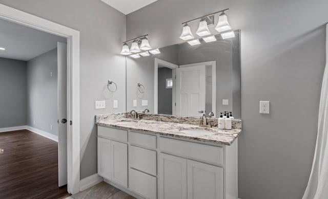 264 Courtland Crest Dr SW, Cleveland, TN 37311 - bathroom with double vanity and wood finished floors