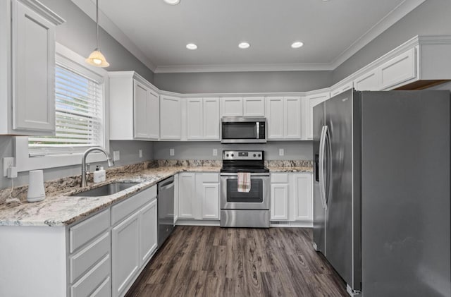 264 Courtland Crest Dr SW, Cleveland, TN 37311 - kitchen with stainless steel appliances, white cabinets, dark wood-style flooring, crown molding, and light stone countertops