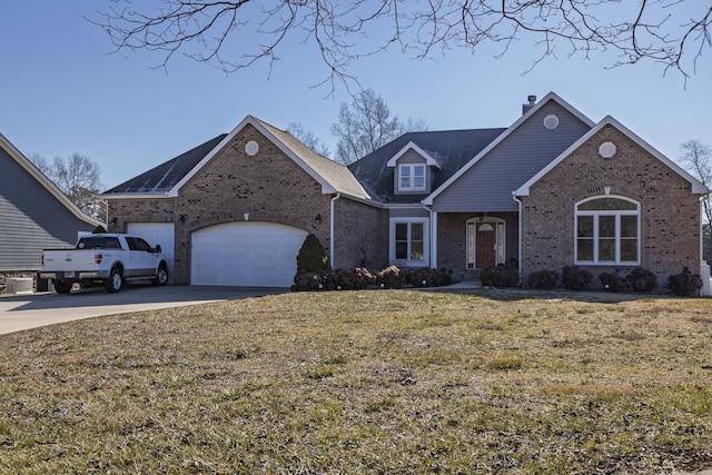 view of front property with a garage and a front lawn