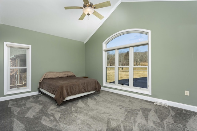 bedroom featuring vaulted ceiling, carpet floors, and ceiling fan