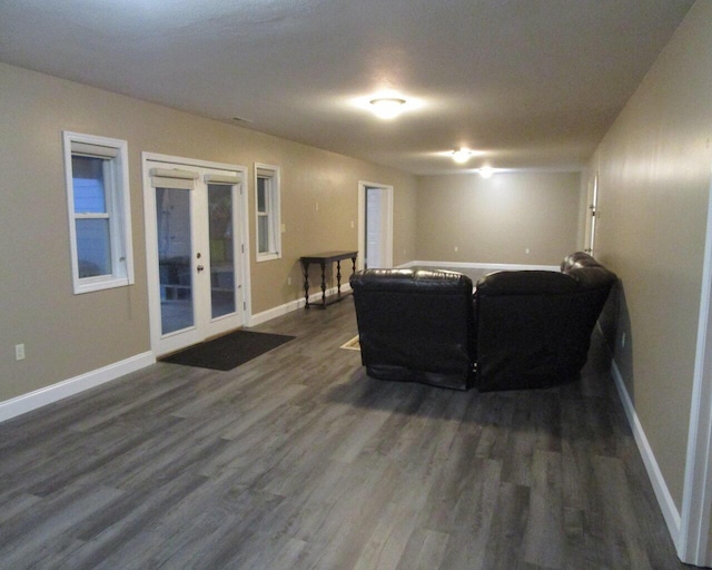 living room featuring dark hardwood / wood-style flooring and french doors