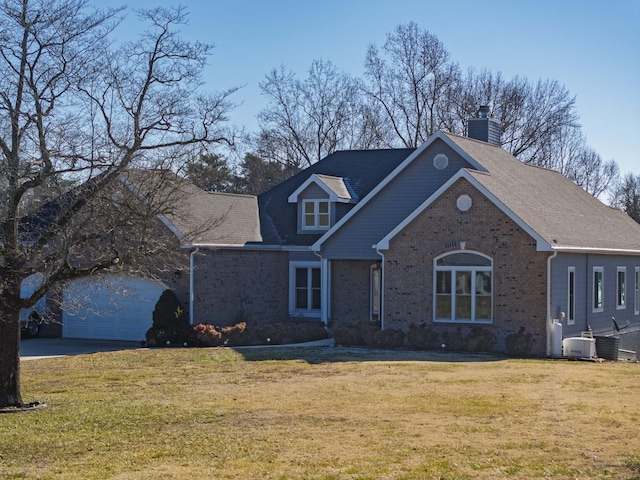 view of front of house featuring a garage, central AC, and a front yard