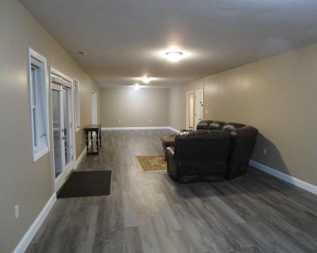 sitting room with dark hardwood / wood-style flooring